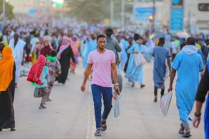 A bustling street scene with people in colorful attire, conveying community and vibrancy.