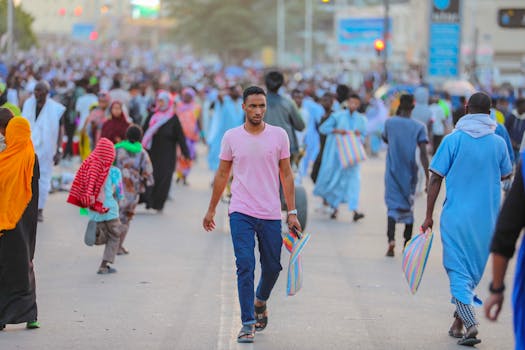 A bustling street scene with people in colorful attire, conveying community and vibrancy.